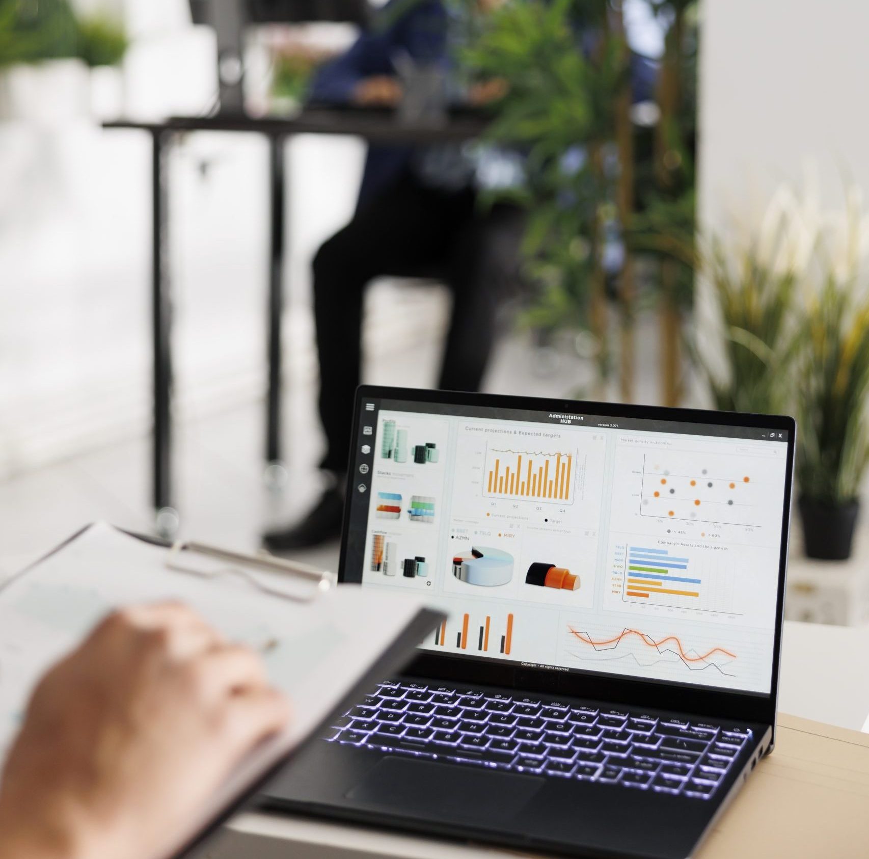Market research statistics graphs on laptop screen
